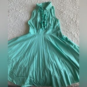 Vintage Sleeveless Turquoise Dress with Ruffle Detail and Tulle Underlay